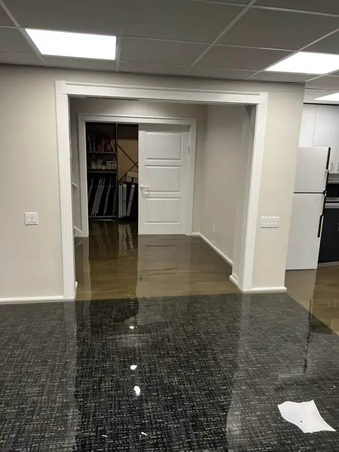Water spread across a finished basement floor in Brentwood, TN