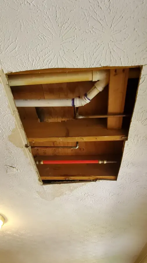 Ceiling opened to reach a leaking supply pipe in a Brentwood, TN home