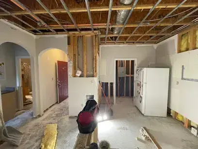 Kitchen ceiling opened to the joists after a frozen pipe split in Brentwood, TN